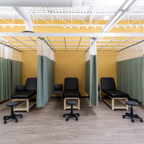 Private curtained treatment bays in the physiotherapy area